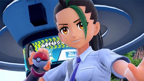 In-game screenshot of Nemona holding a Poké Ball and looking at the camera.