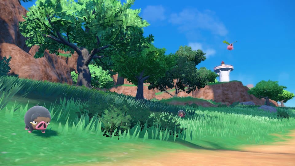 Gameplay screenshot, grassy landscape with Pokémon