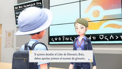 Gameplay screenshot of trainer outside of a gym.