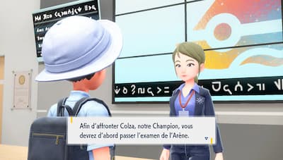Gameplay screenshot of trainer outside of a gym.